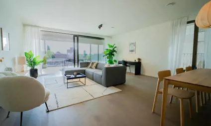 Large living room at level with panoramic view of the city of Hasselt.