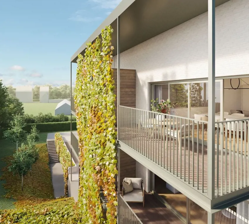 Appartementsgebouw met terrassen die uitgeven op mooie groene binnentuin