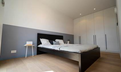 Bed van een 2 slaapkamer appartement