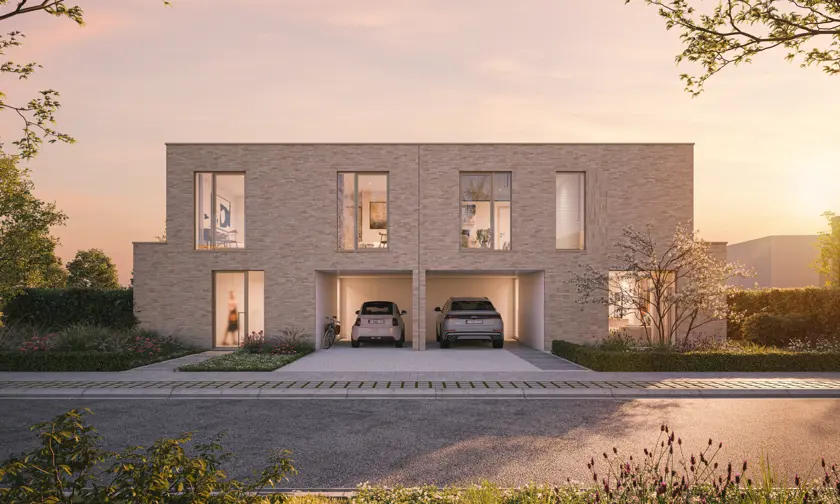 Modern duplex house with two garages, each containing a car. The house is built with light-colored bricks and features large windows. Trees and plants surround the house. The sky has a warm, pinkish hue, indicating either sunrise or sunset.