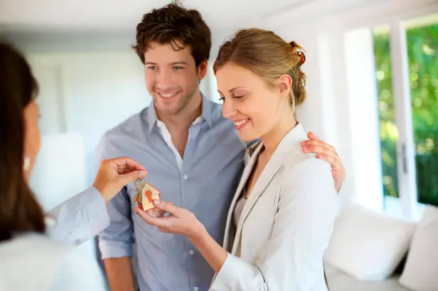 Couple handed the key to a property